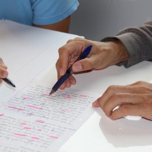Picture of a teacher proofreading a student's work